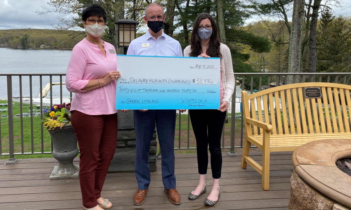 Woodloch Resorts presents a check to Delaware Highlands Conservancy.