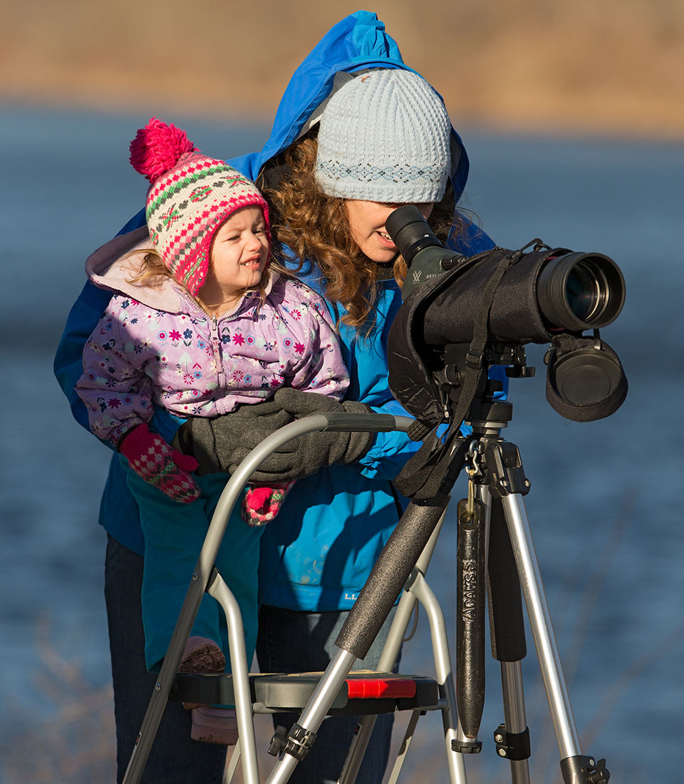 mom with toddler using viewing scope