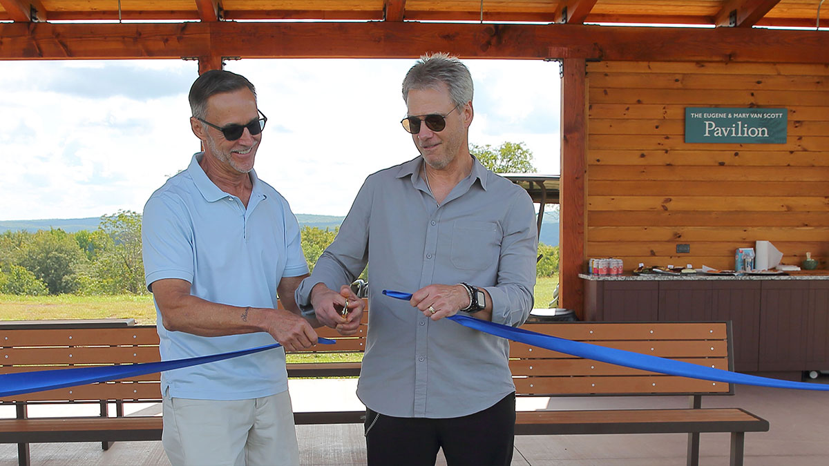 David and Stephen Van Scott cut the ribbon on the new pavilion at the Van Scott Nature Reserve.