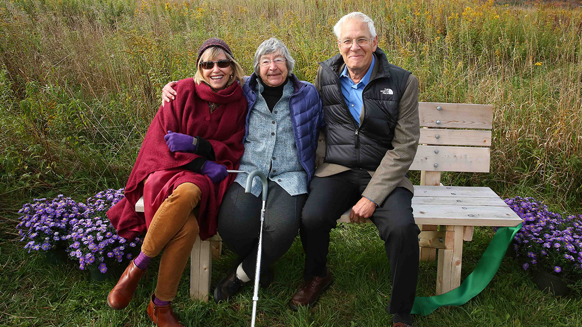 Conservancy founder Barbara Yeaman with her daughter Suzanne and son Bill at "Ed's Bench" at the Van Scott Nature Reserve.